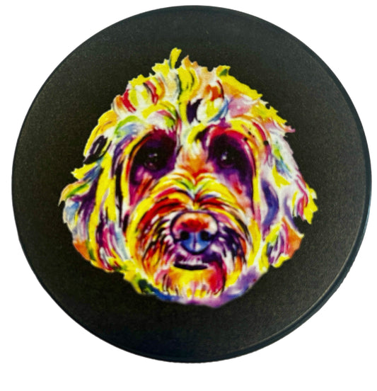 Round black coaster featuring a colorful abstract painting of a dog face