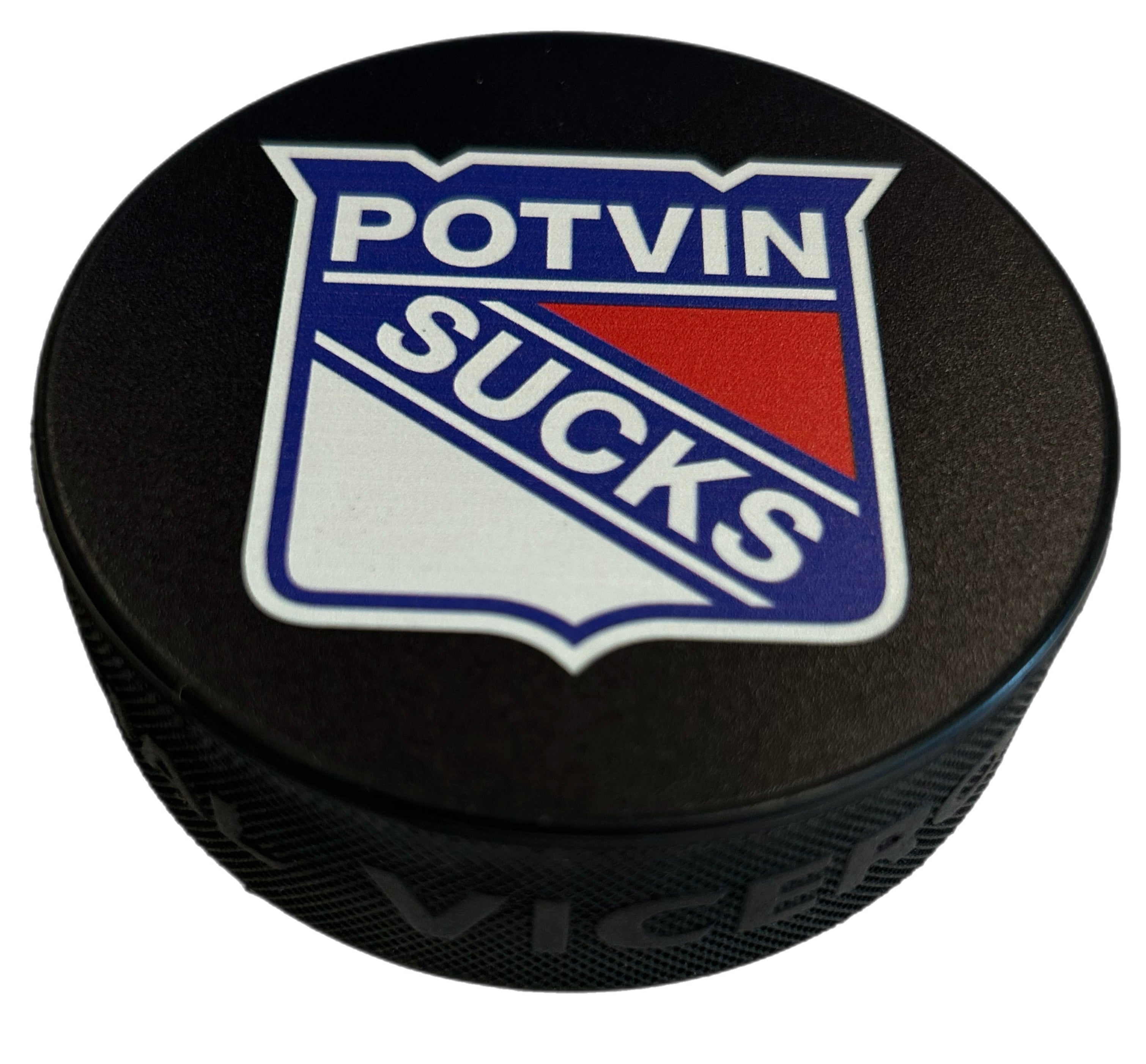 Black hockey puck with a shield graphic reading Potvin Sucks