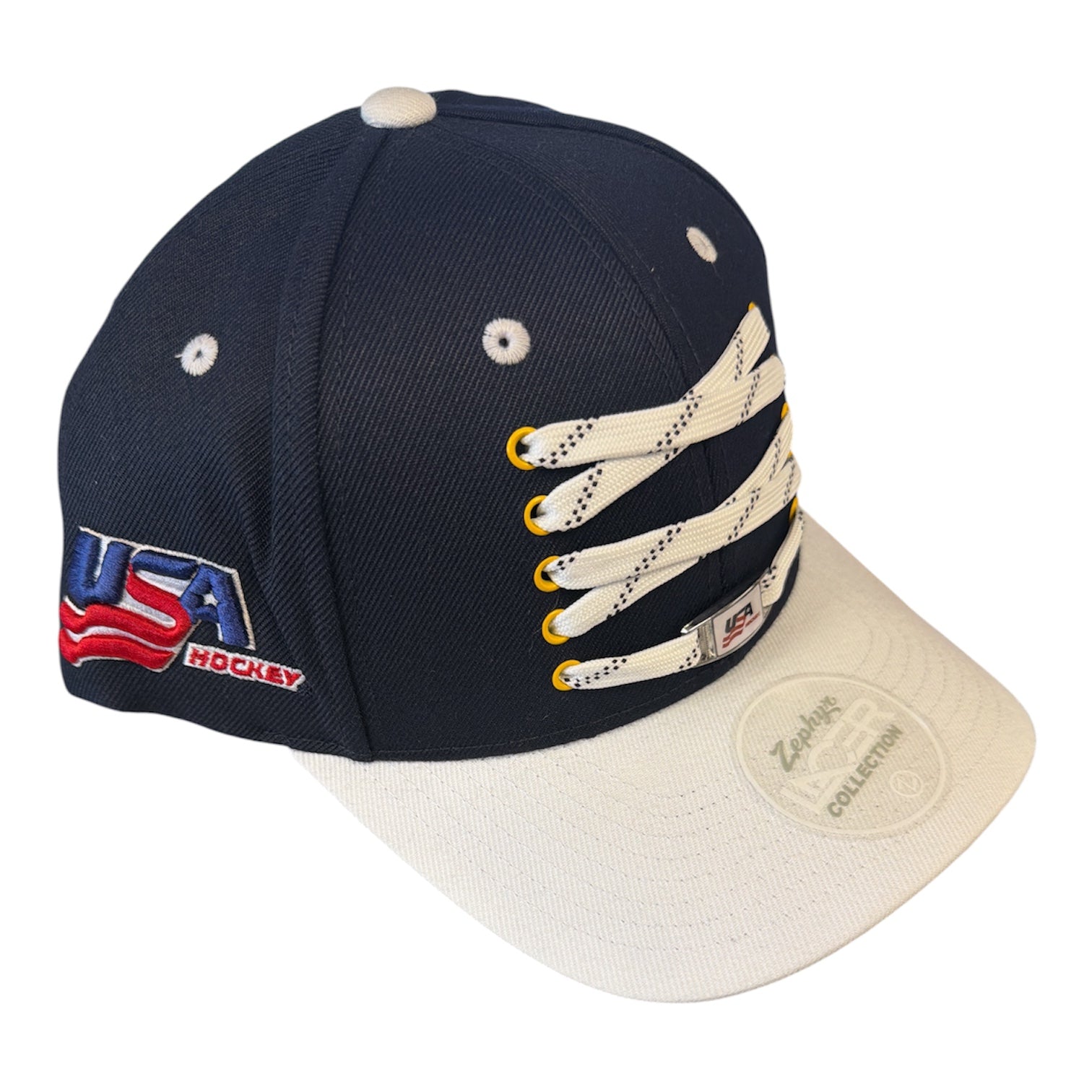 Navy blue and white USA Hockey baseball cap with lace up detail on the front