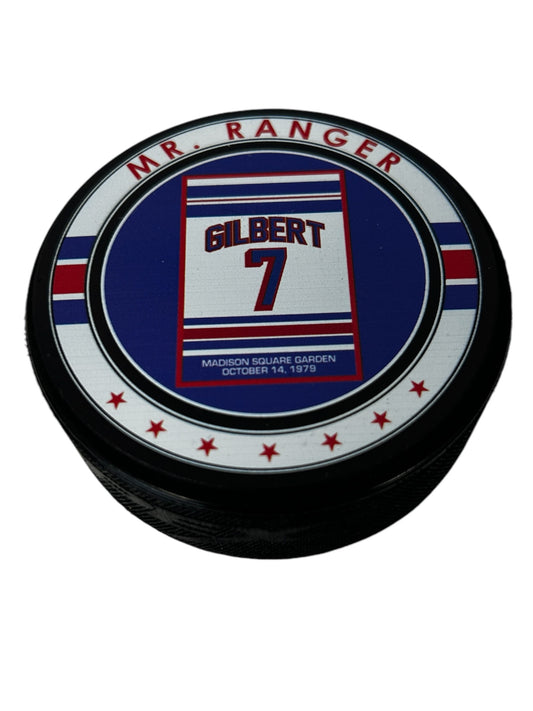 Rod Gilbert commemorative hockey puck with number 7 and Madison Square Garden text