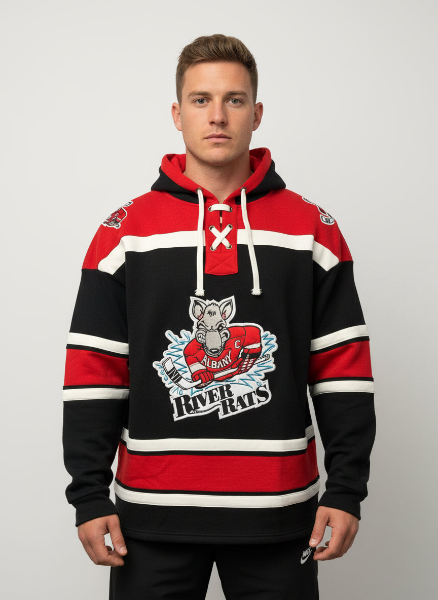 Man wearing a black red and white Albany River Rats hockey lace up hoodie