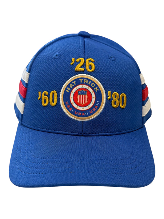 Blue baseball cap with USA Hockey Hat Trick embroidery and years 60 80 and 26