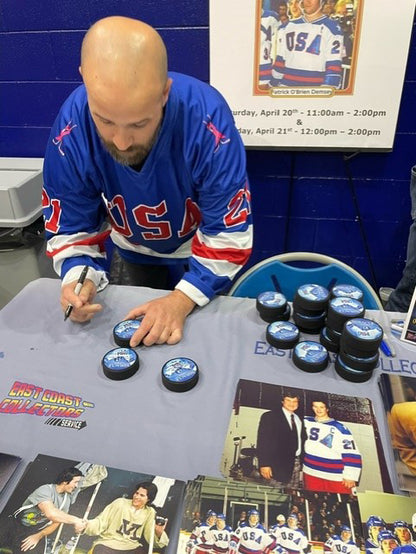 USA Hockey Puck Signed by Patrick O’Brien Demsey ( Mike Eruzione #21 )