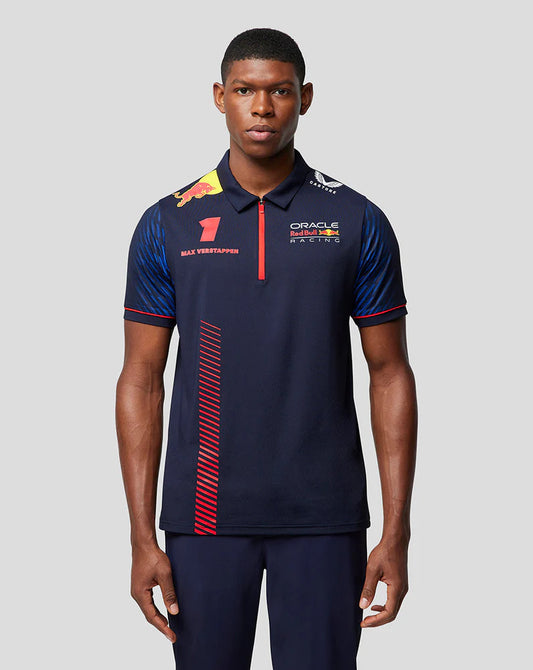 Man wearing a navy blue Oracle Red Bull Racing polo shirt with team branding and Max Verstappen name