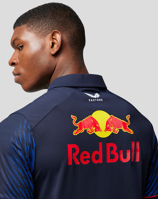 Man wearing a navy blue Red Bull polo shirt with Castore branding
