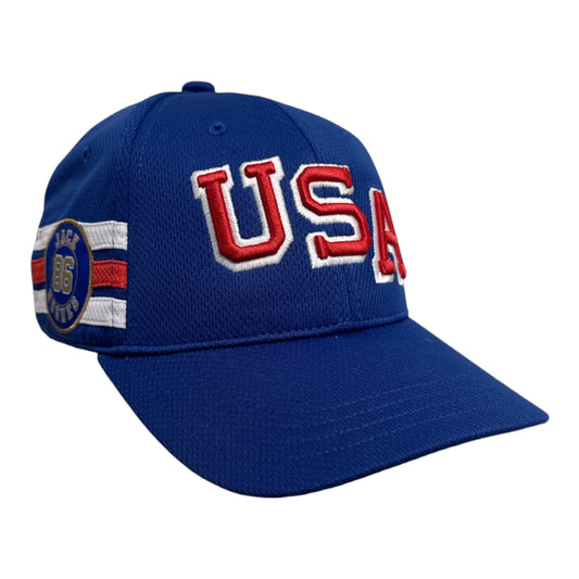 A royal blue baseball cap featuring 'USA' embroidered in red and white on the front, with a side patch reading 'JACK 1867 LIVER'.
