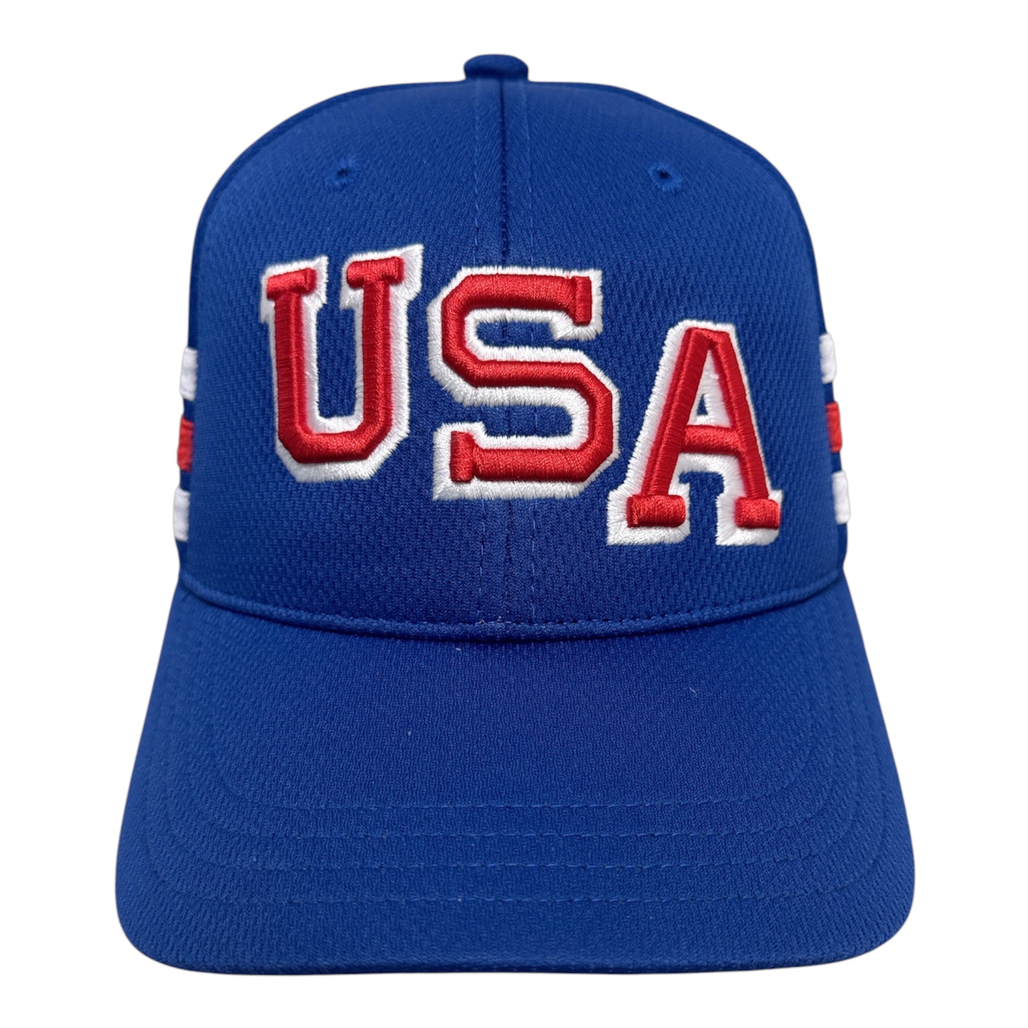A royal blue baseball cap featuring 'USA' embroidered in red and white on the front, with small red and white flag details on the side panels, shown against a plain white background.